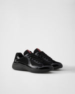 Sneakers Prada America's Cup en cuir verni et tissu technique
